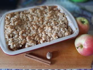 Close-up of a golden apple crumble fresh out of the oven, with steam rising gently.