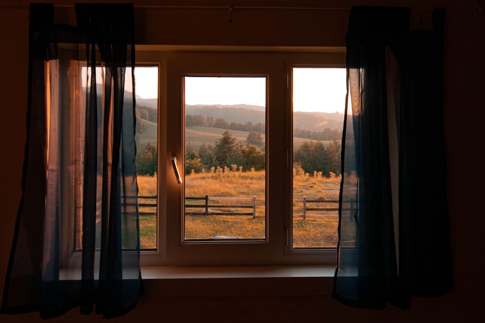 white wooden framed glass window