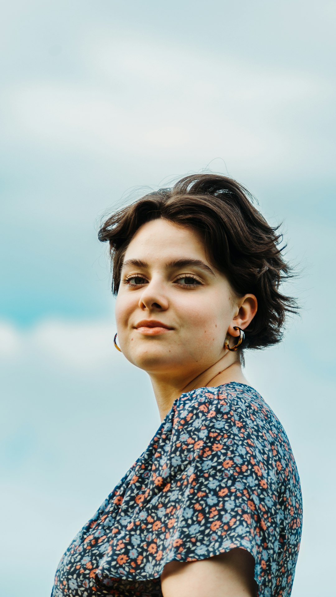 woman in blue and white floral shirt