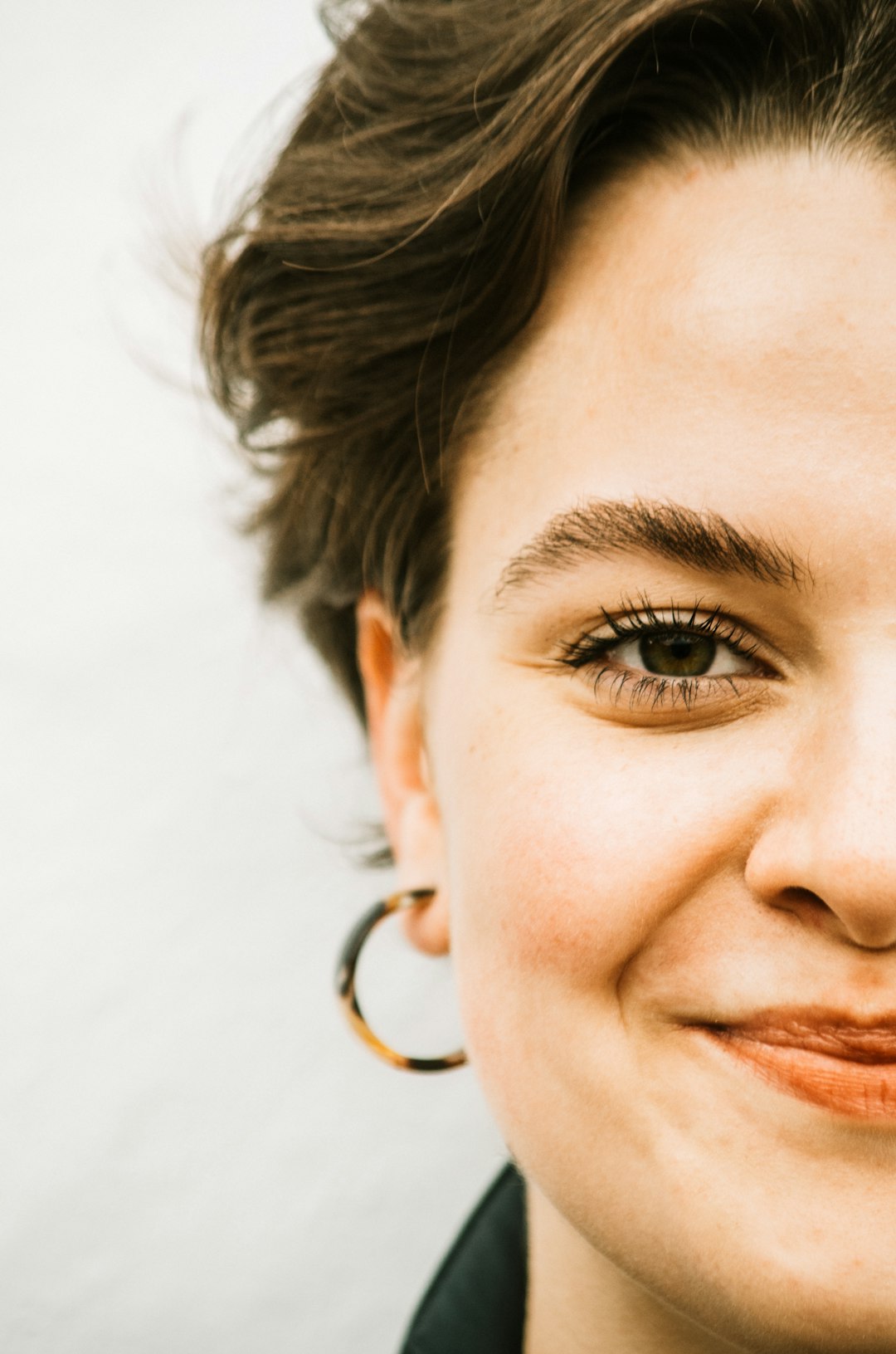 woman with gold hoop earrings