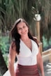 woman in white halter top smiling