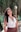 woman in white halter top smiling