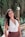woman in white halter top smiling