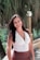 woman in white halter top smiling