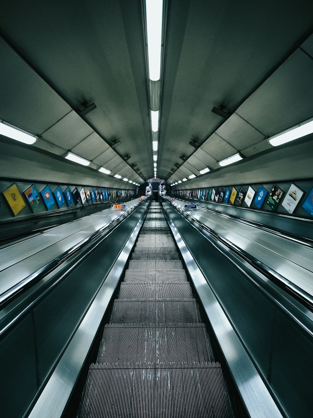 black escalator in a tunnel