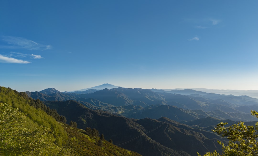 green mountains under blue sky during daytime