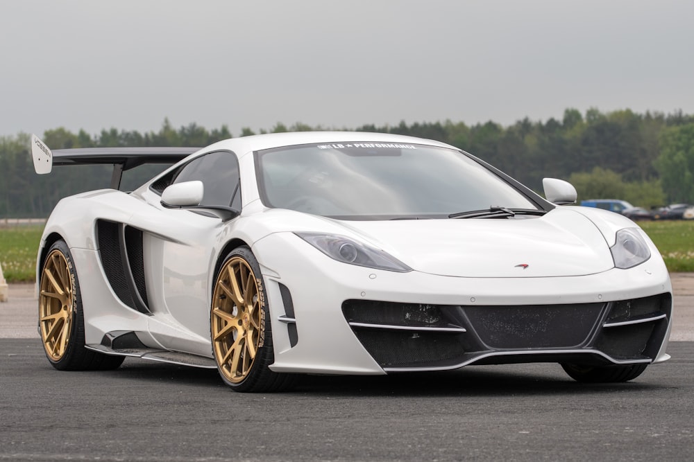 white lamborghini aventador on road during daytime