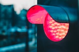 A close-up of a driver carefully observing traffic signals at a busy city intersection.