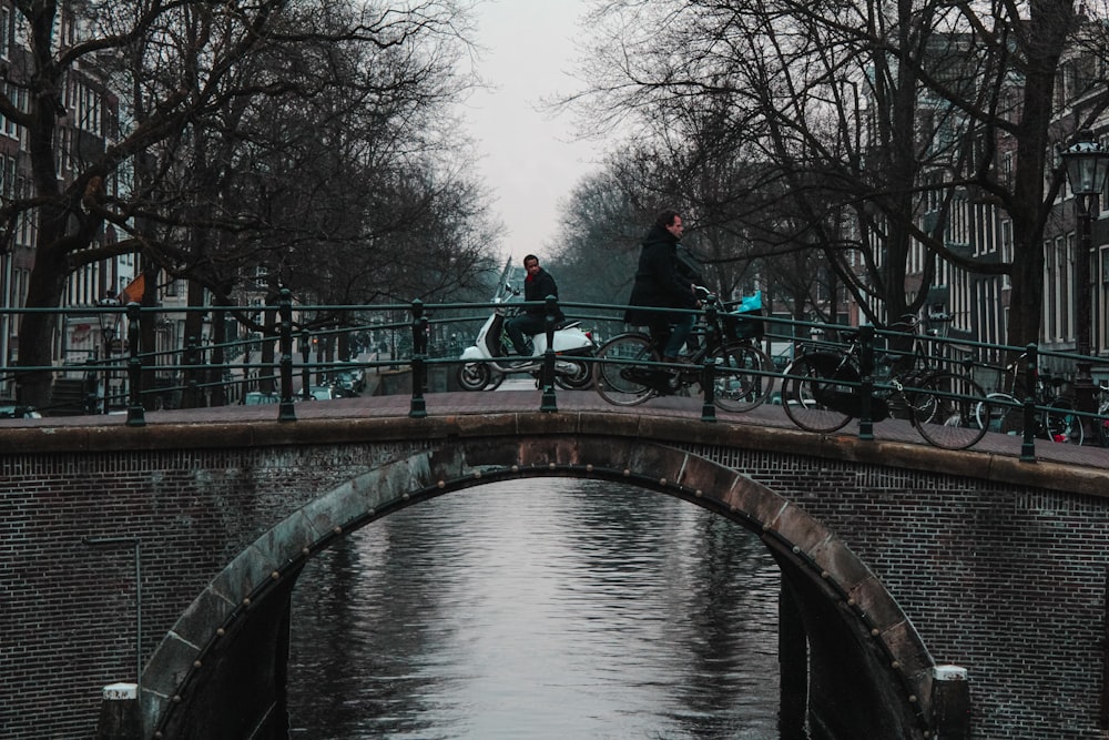 people walking on bridge during daytime