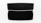 A black speaker with a sleek, modern design is centered against a white background. The speaker is rectangular with fine mesh detailing on the front. A shadow extends below it, accentuating its dimensions.