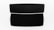 A black speaker with a sleek, modern design is centered against a white background. The speaker is rectangular with fine mesh detailing on the front. A shadow extends below it, accentuating its dimensions.