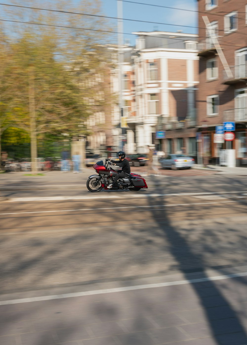 man riding motorcycle on road during daytime