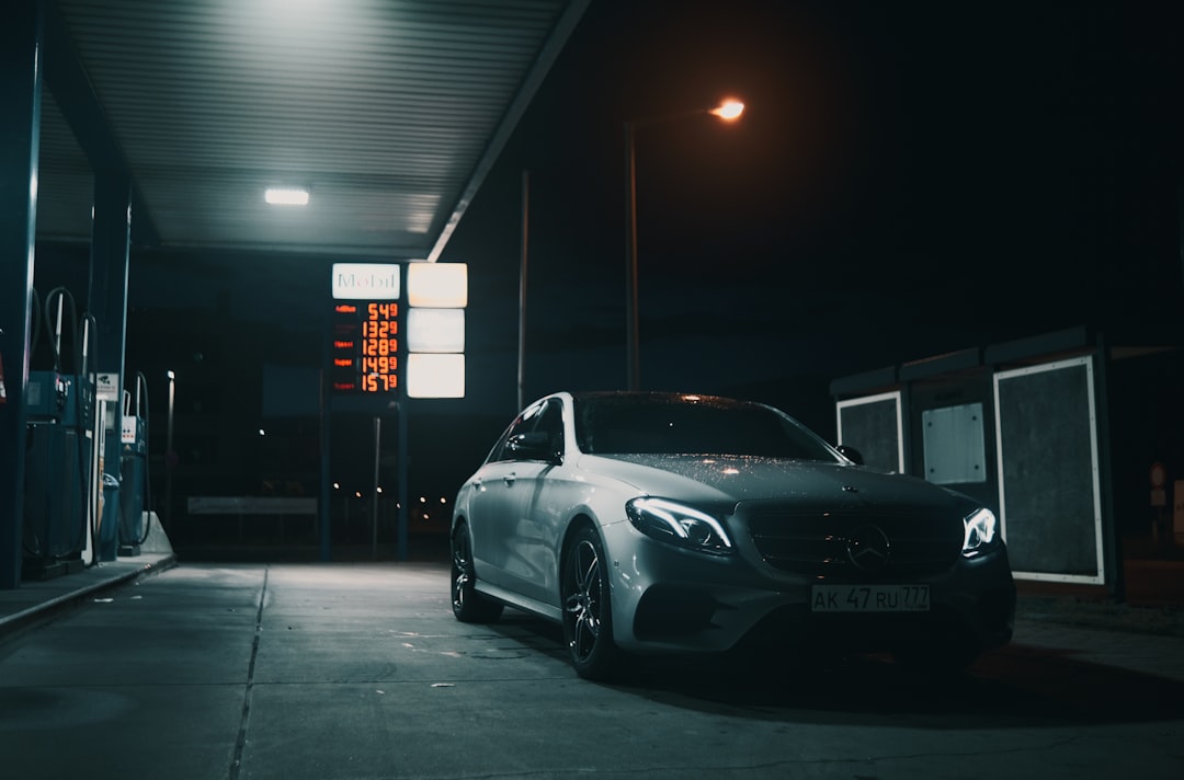 black bmw m 3 coupe parked on parking lot during night time