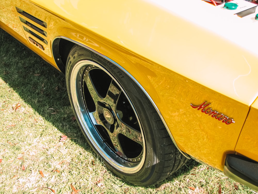 yellow and white car on green grass