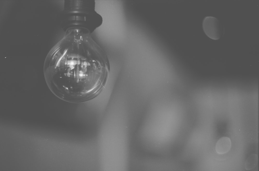 grayscale photo of light bulb