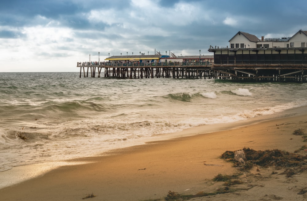 brown wooden dock on sea during daytime