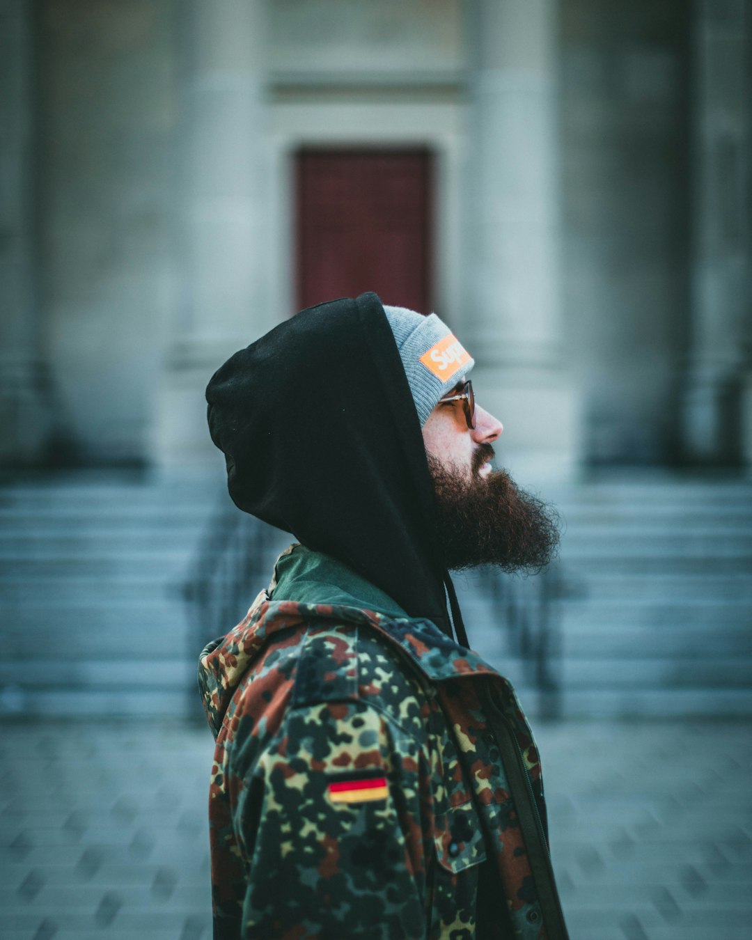 man in black and red floral shirt wearing white bandana