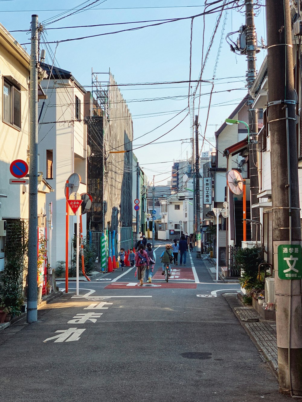 people walking on sidewalk during daytime