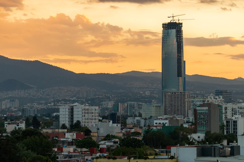 high rise building near mountain during daytime