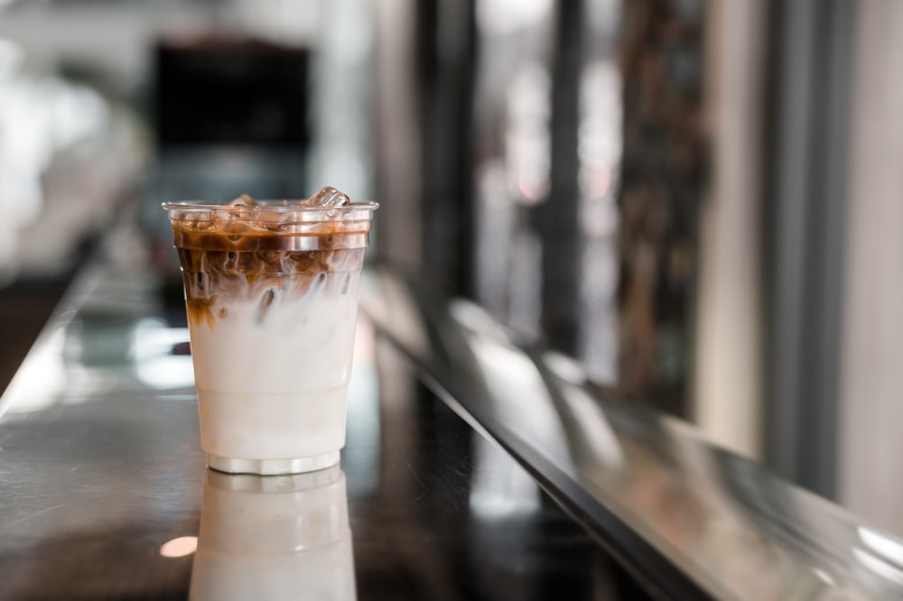 white liquid in clear drinking glass