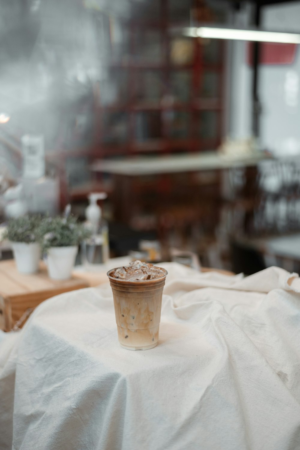 clear drinking glass on white table cloth