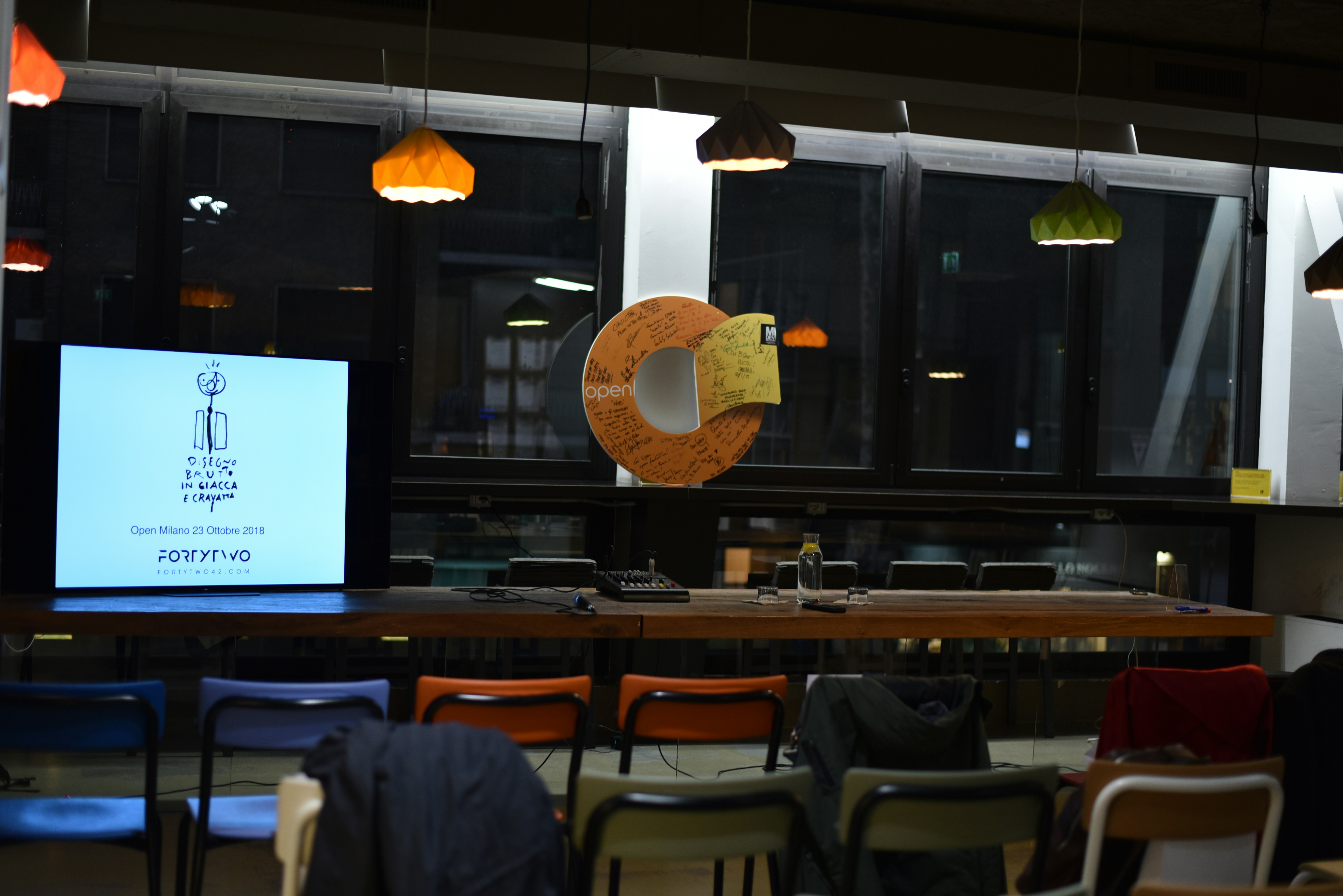 Close-up view of a Ricoh interactive whiteboard glowing with digital notes in a stylish NYC office.