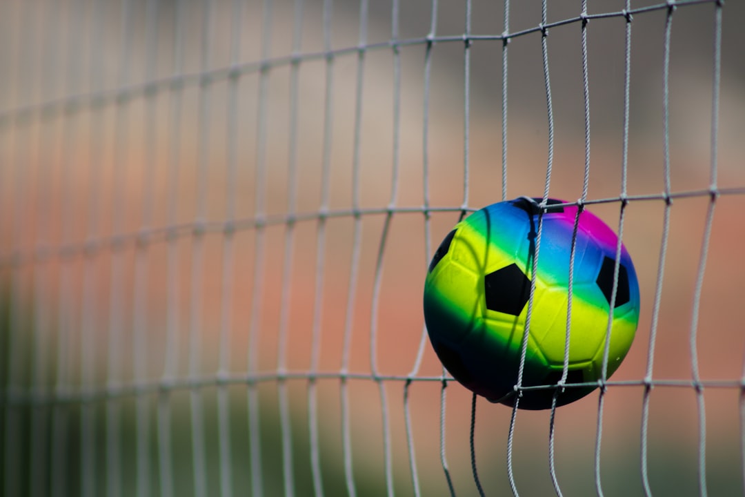 green and black soccer ball