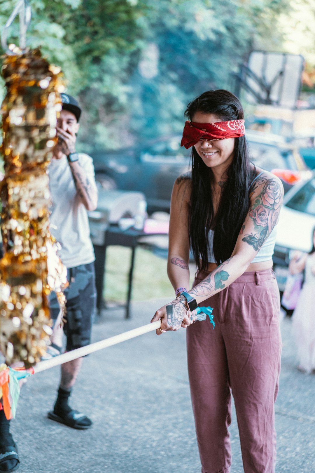 woman in white and black floral sleeveless dress wearing red sunglasses