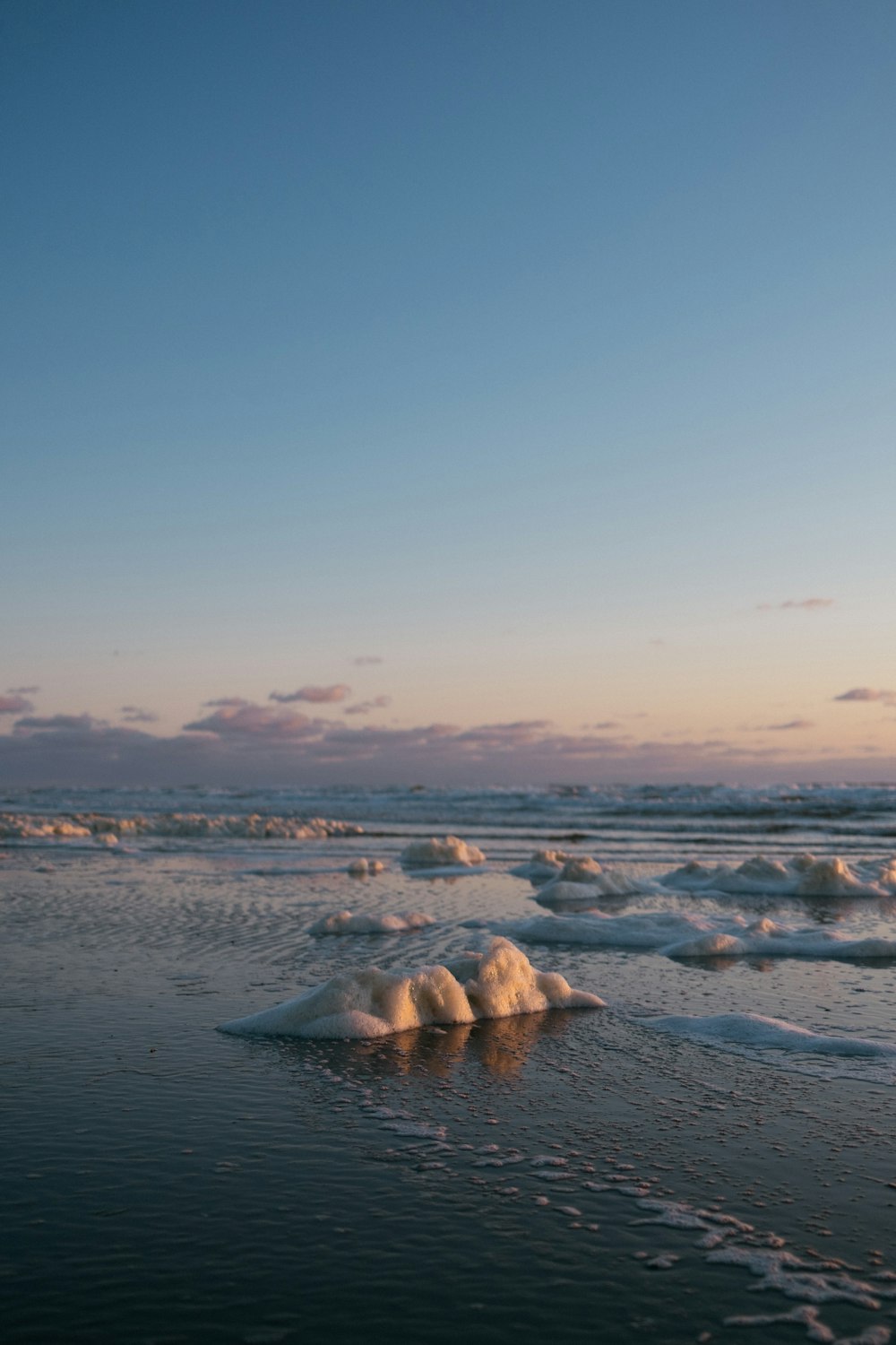 ice blocks on beach shore during daytime