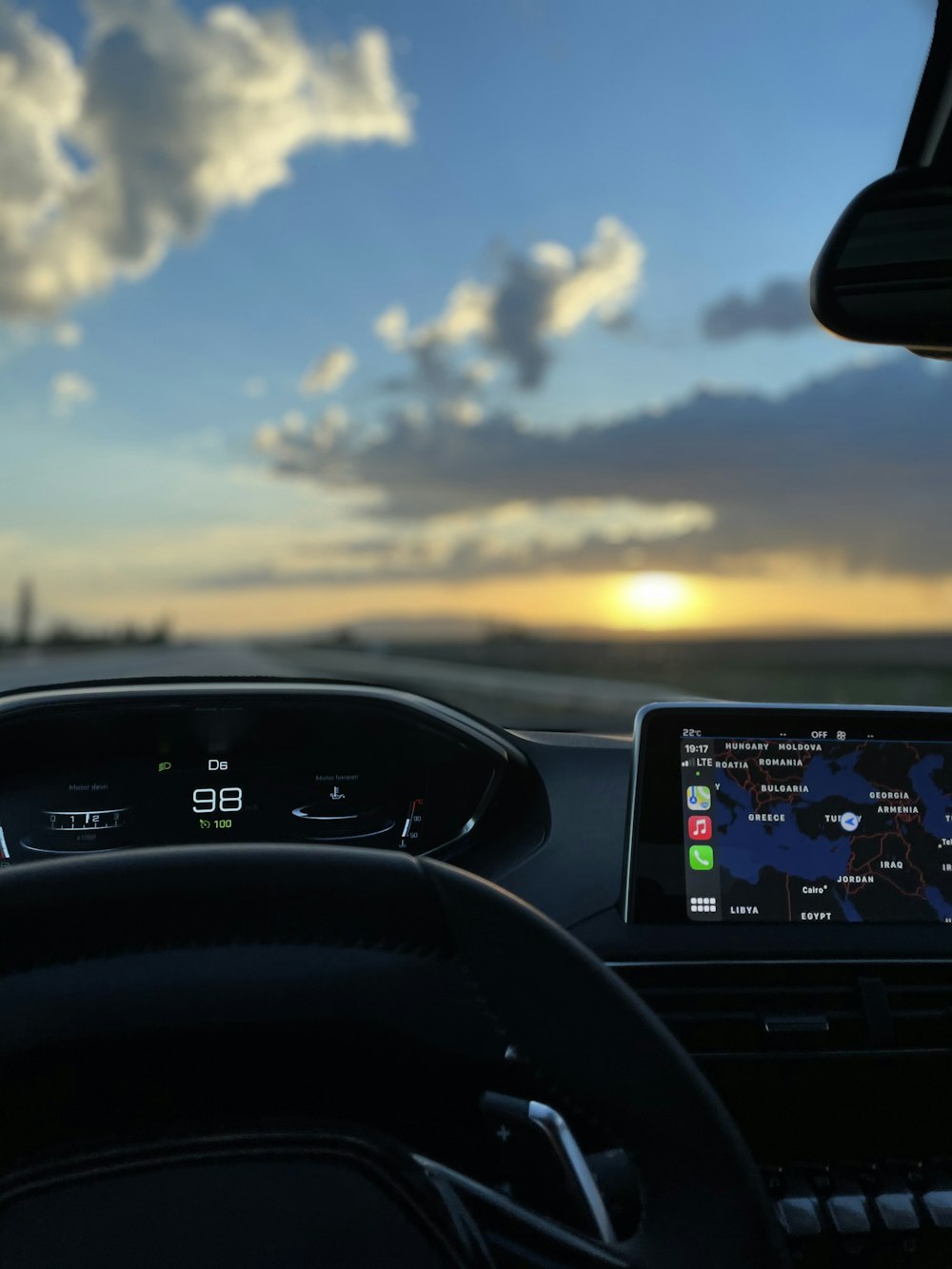 black car dashboard with digital device