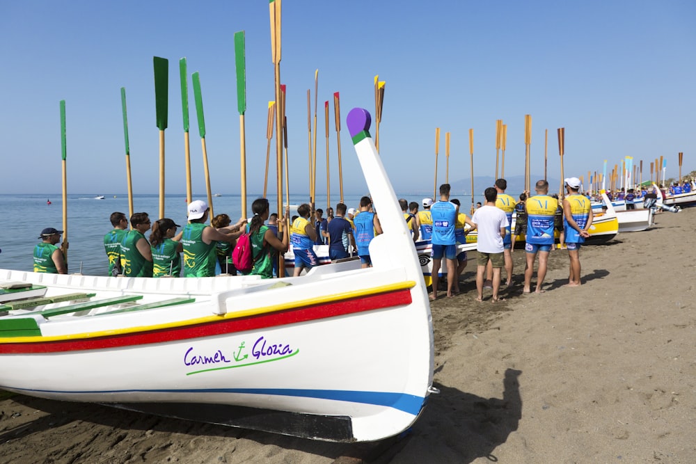 people riding on white and blue boat during daytime