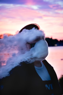person in black jacket smoking