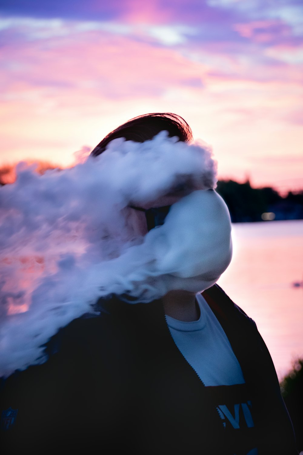 person in black jacket smoking