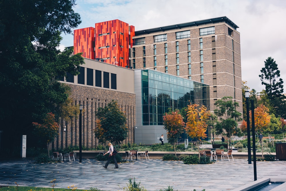 people walking on park near building during daytime