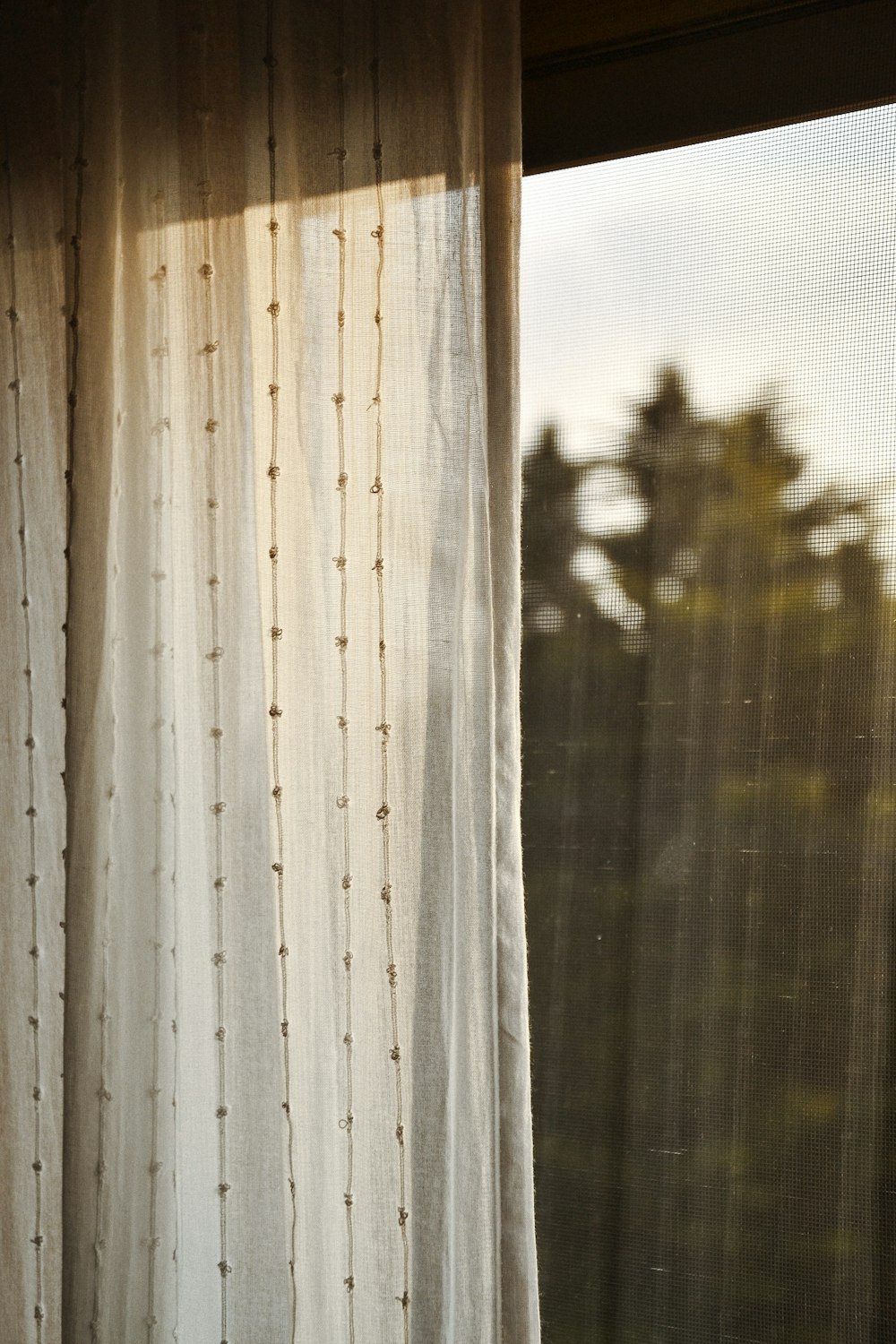 white window curtain during daytime