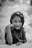 A close-up shot of an Uzbek girl with captivating eyes and a warm smile.