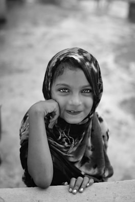 A close-up shot of an Uzbek girl with captivating eyes and a warm smile.