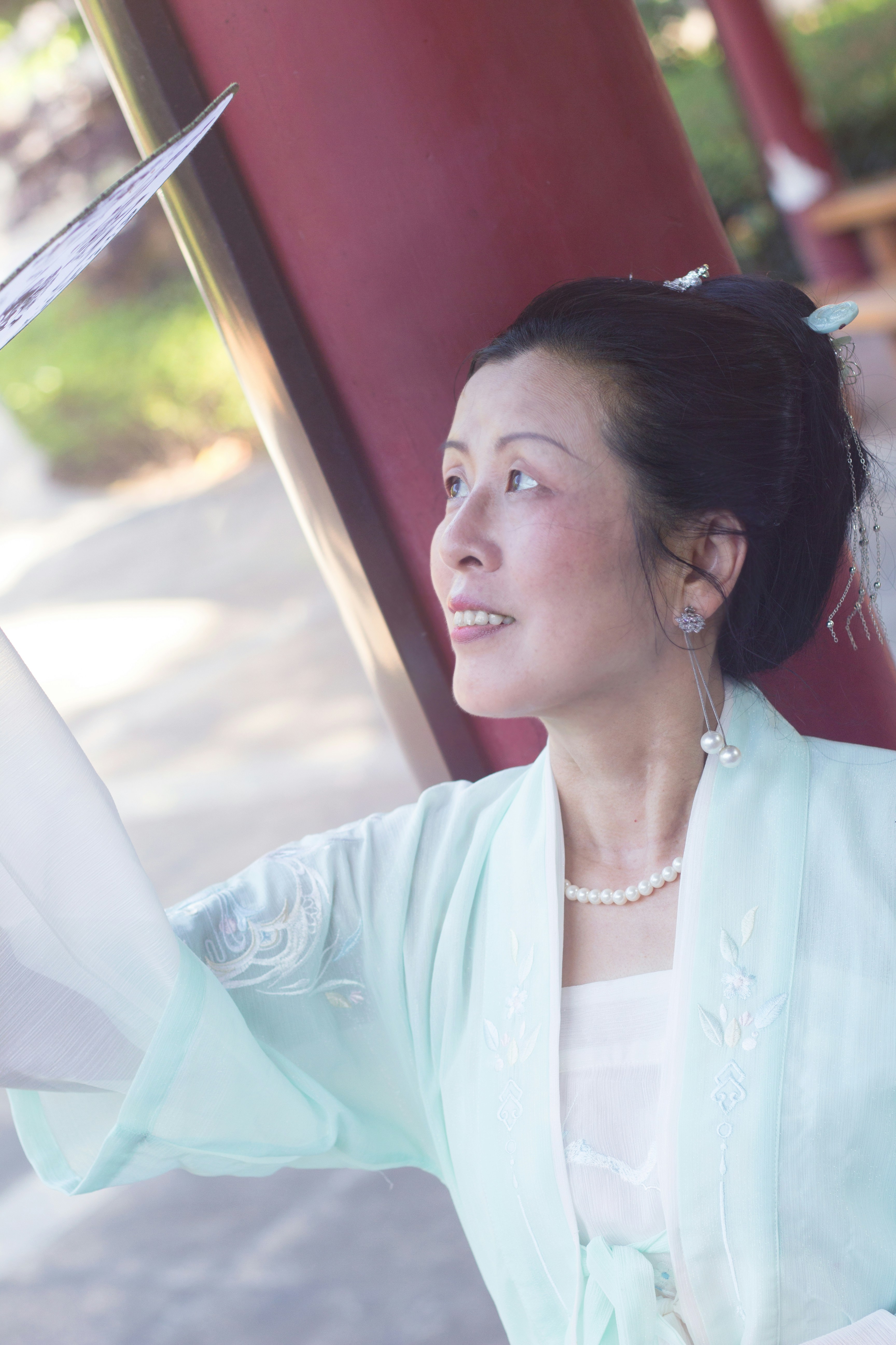woman in white dress shirt wearing silver necklace