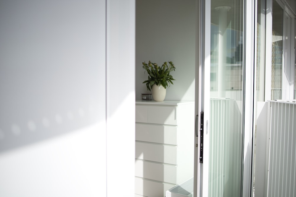 white wooden framed glass door