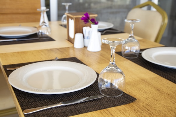 clear wine glass on brown wooden table