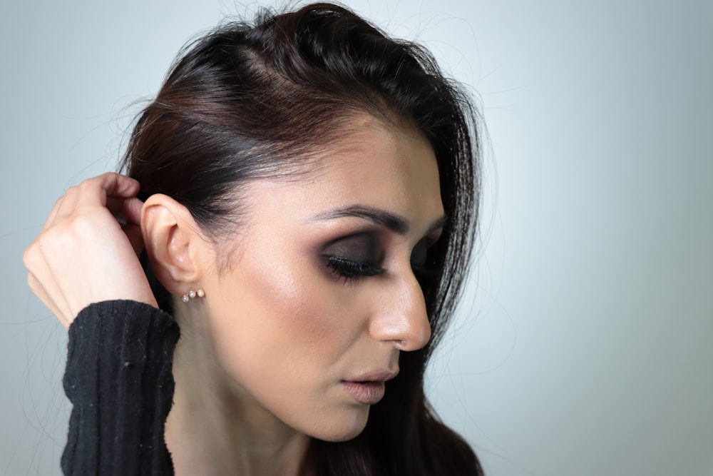 woman in black shirt with brown hair