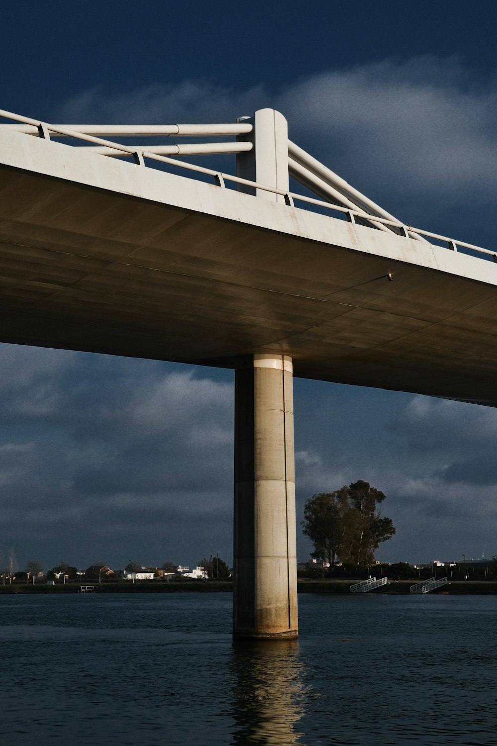 white bridge over body of water during daytime