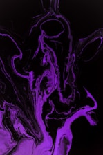 A dynamic abstract shape in black and purple gradients symbolizing creative energy.
