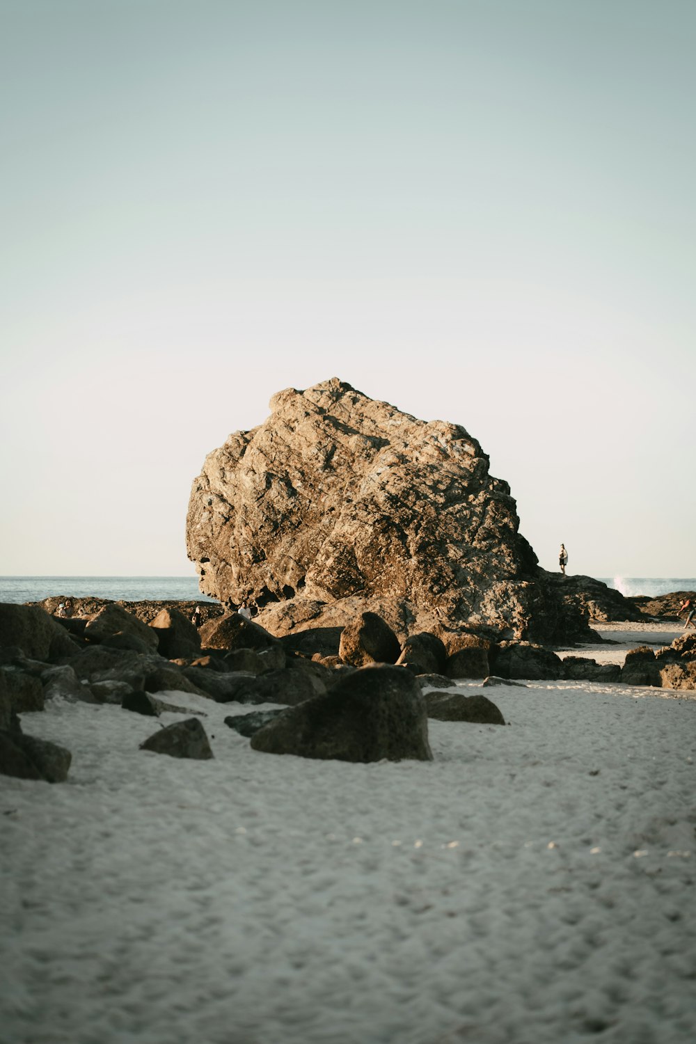 brown rock formation on sea shore during daytime