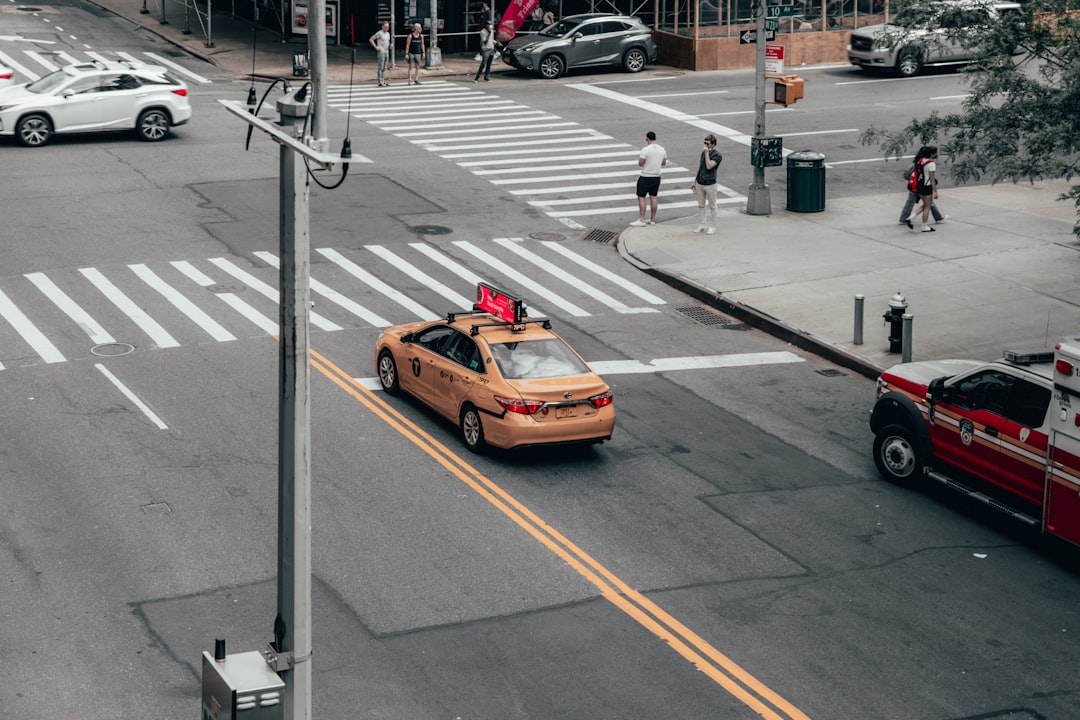 yellow car on the road during daytime