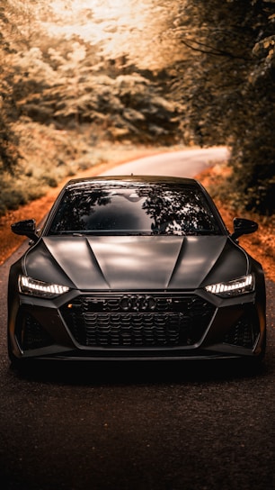 black audi a 4 on road during daytime