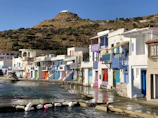 Traditional Bulgarian coastal village street with white houses and vibrant shutters.