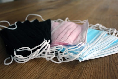 A stack of latex gloves in various sizes and colors.