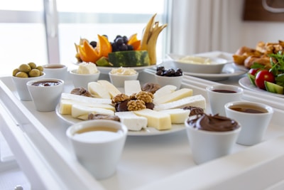 white ceramic bowls on white table
