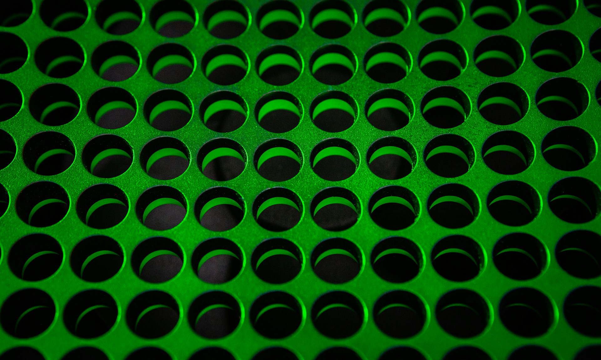 green and black polka dot textile